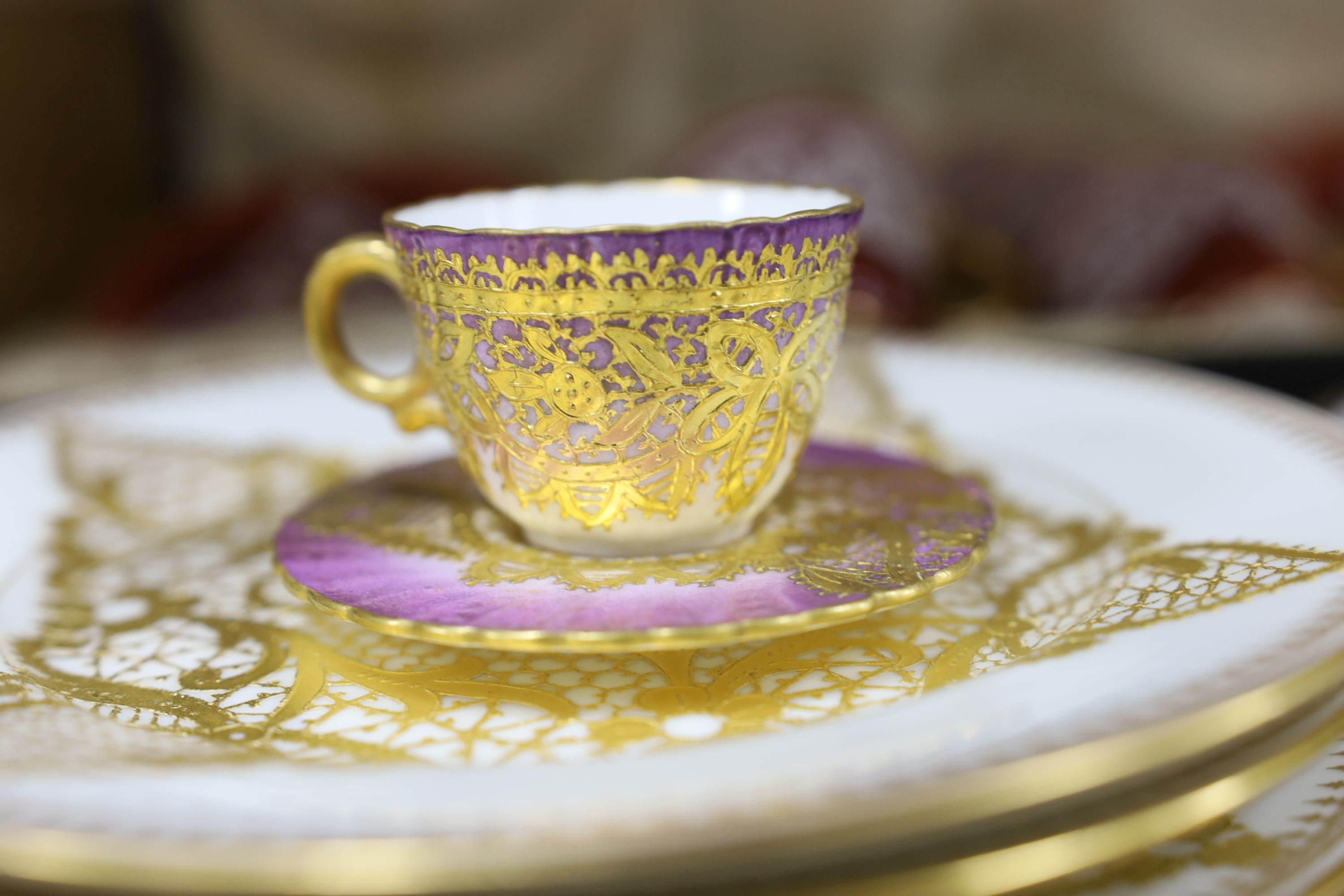 Venetian decorated Lace-pattern ceramics including a cased coffee set and a pair of plates painted with named views of Venice